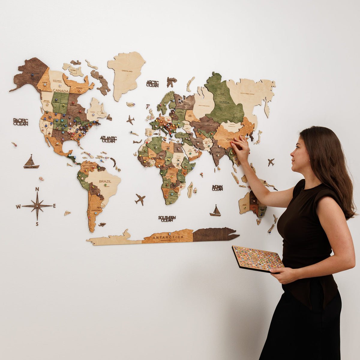 3D wooden world map on a living room wall